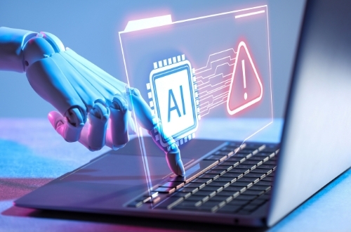 Imagen de robot usando un computador que muestra la ia aplicada